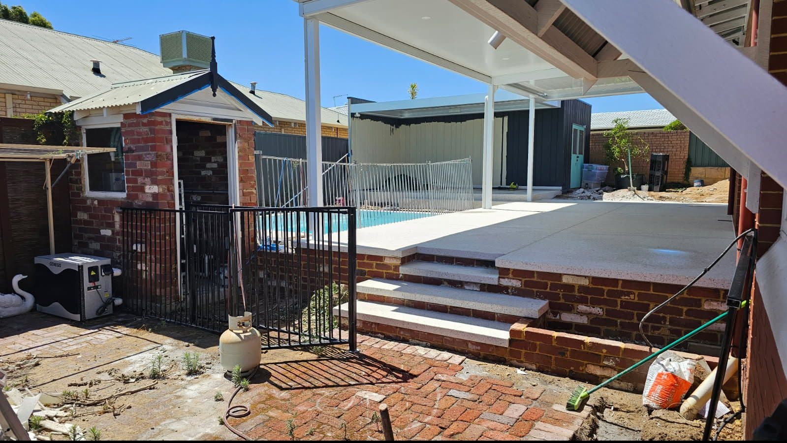 Honed aggregate split level patio and outdoor kitchen area in Bicton