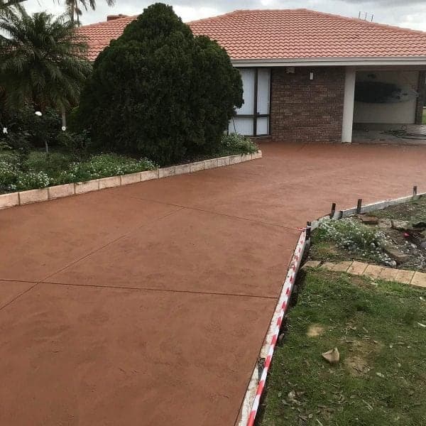 Coloured concrete driveway installed in Perth
