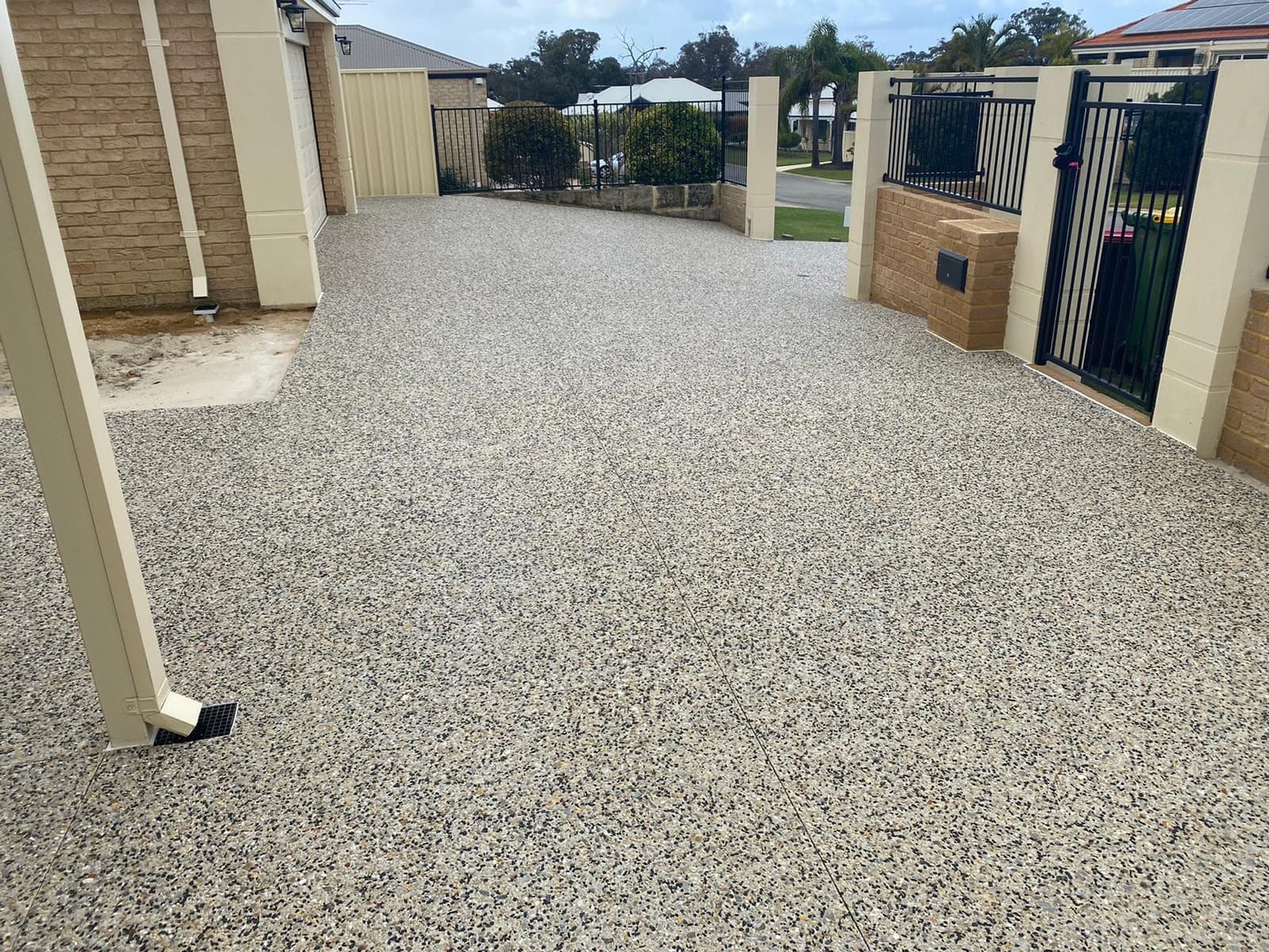 Exposed aggregate side access and driveway concrete
