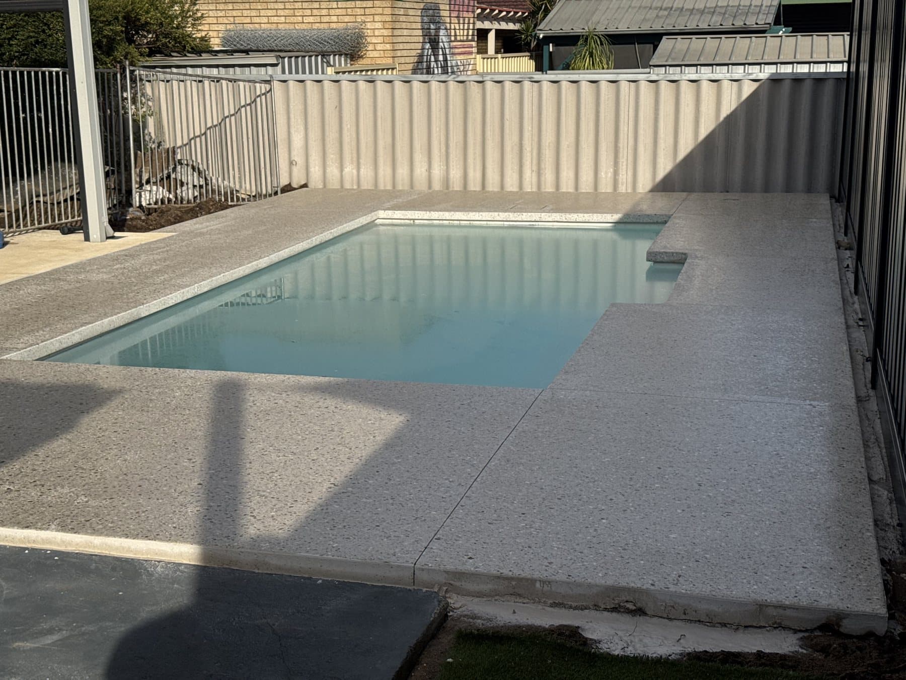 Honed aggregate seamless pool edge and pool surround in Lake Coogee