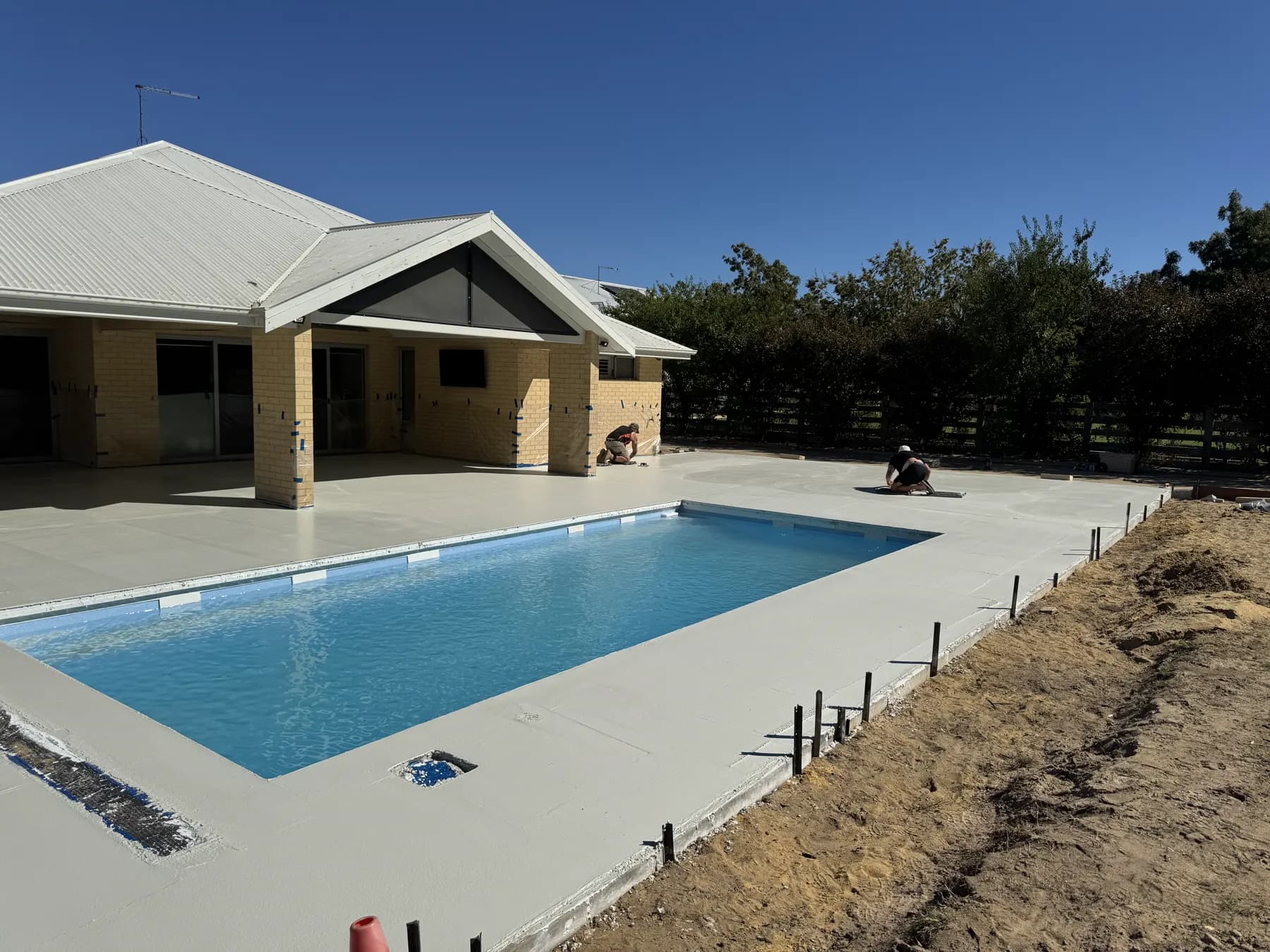 Completed pool surround concrete area ready for honing